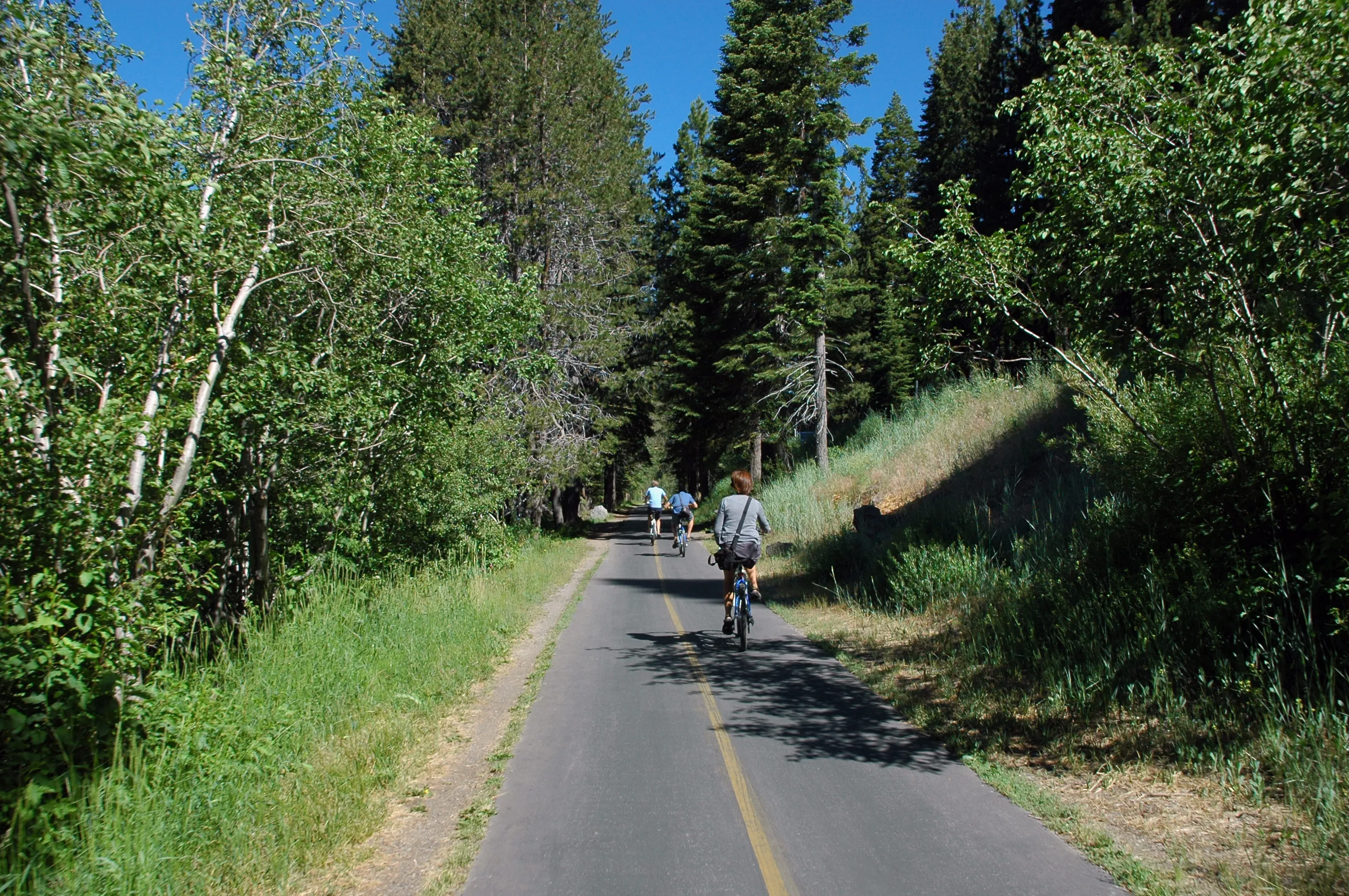 The paved Truckee River multi-use trail running beside the river near Tahoe City